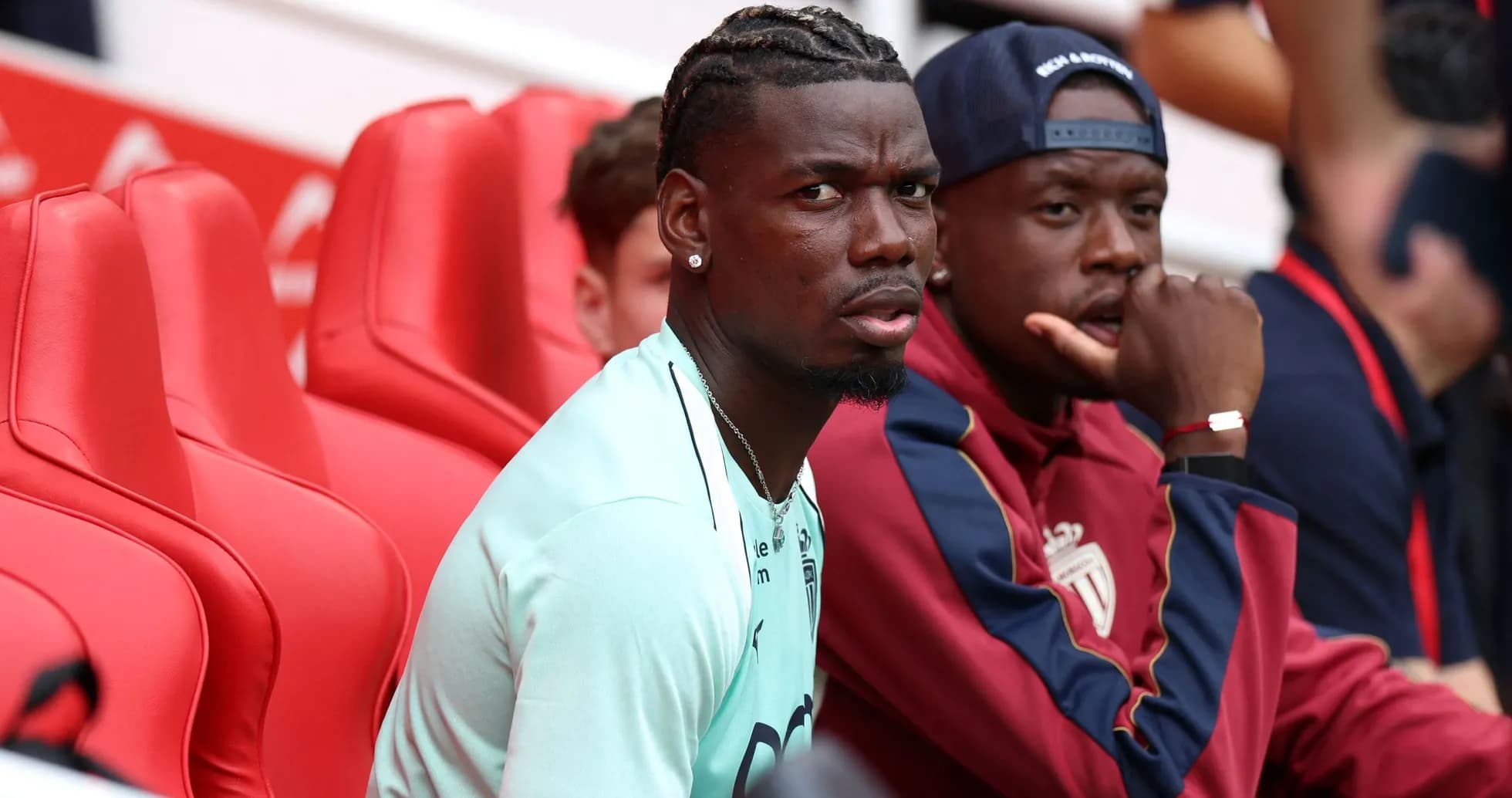 Two players sitting on the bench during a match Two players sitting on the bench during a match