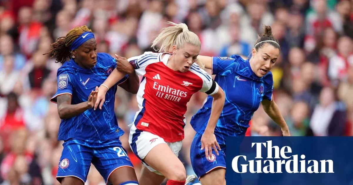 Two players tackling Arsenal player during match Two players tackling Arsenal player during match