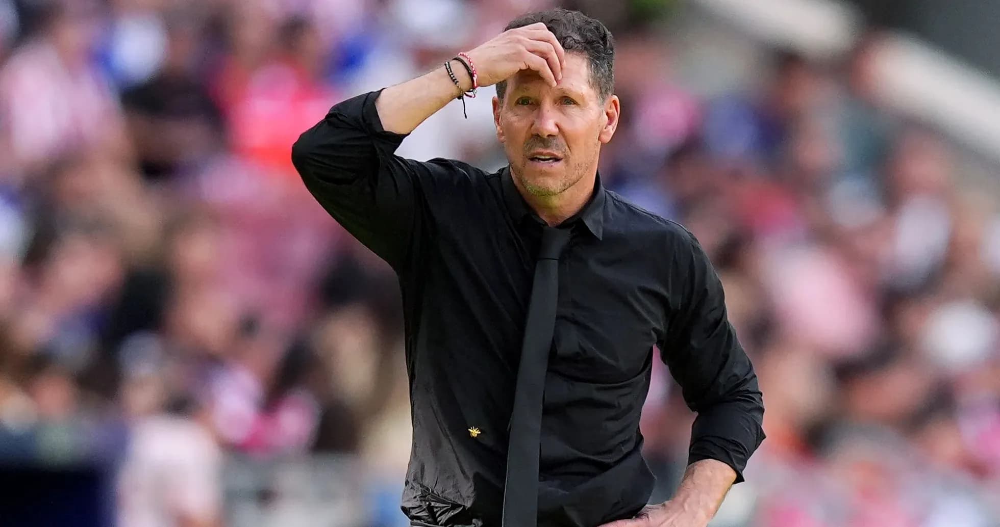 Coach with hand on forehead during match Coach with hand on forehead during match