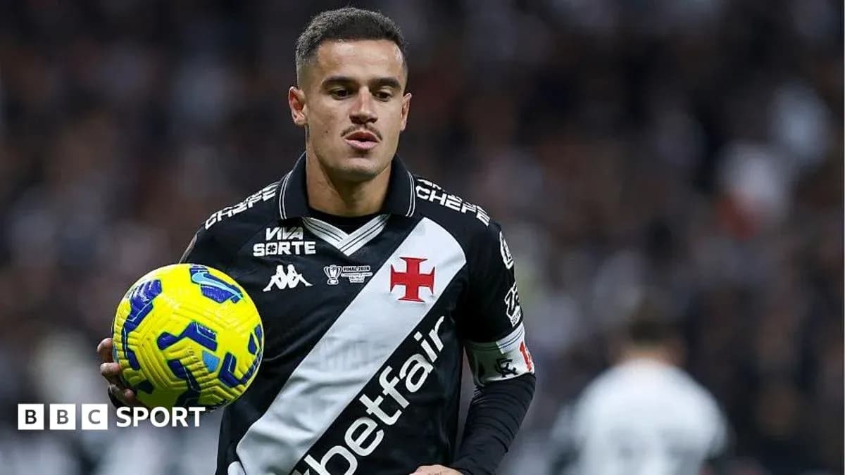 Player holding ball during football match action Player holding ball during football match action