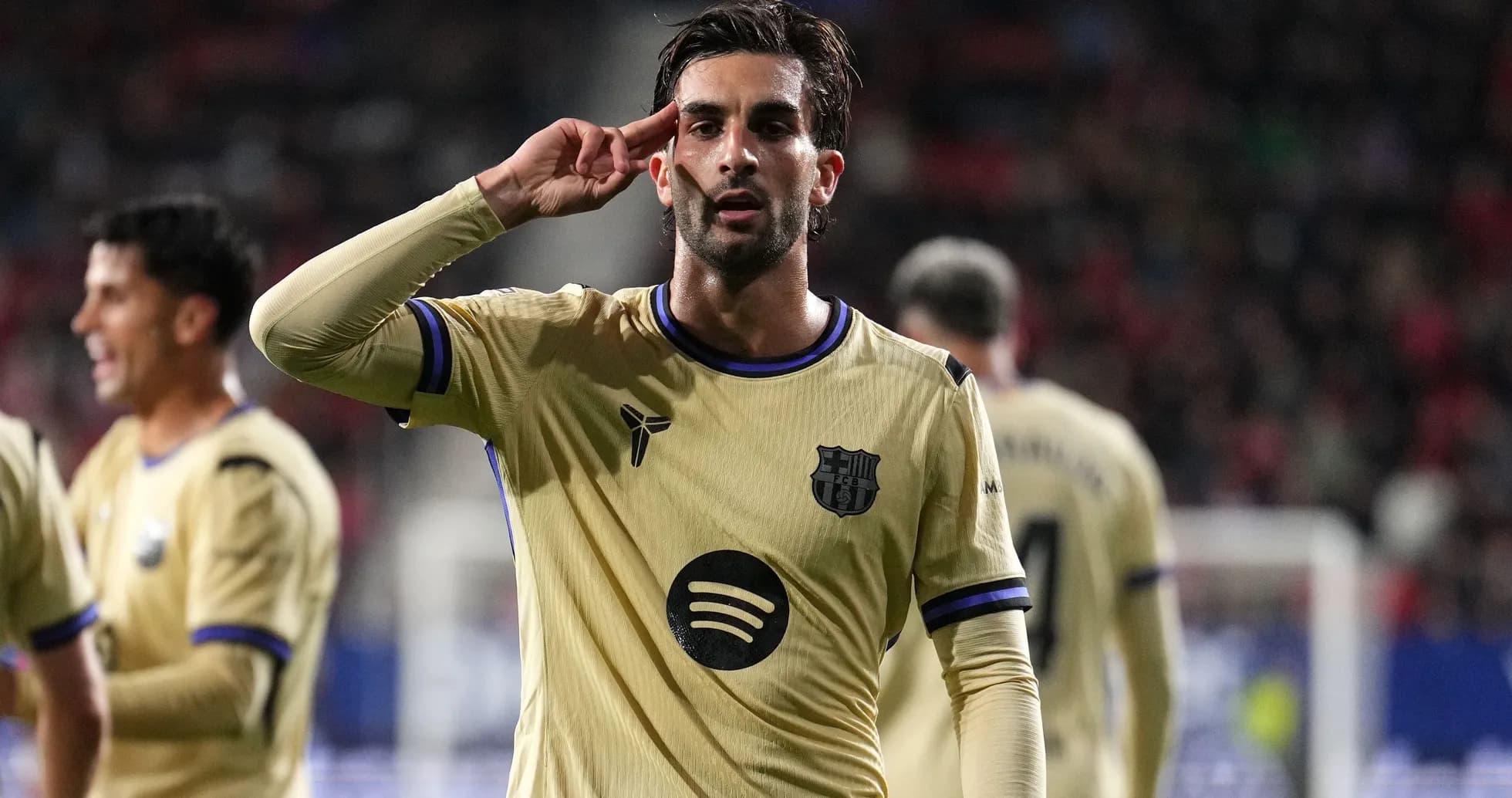 Player celebrating with salute gesture after scoring Player celebrating with salute gesture after scoring
