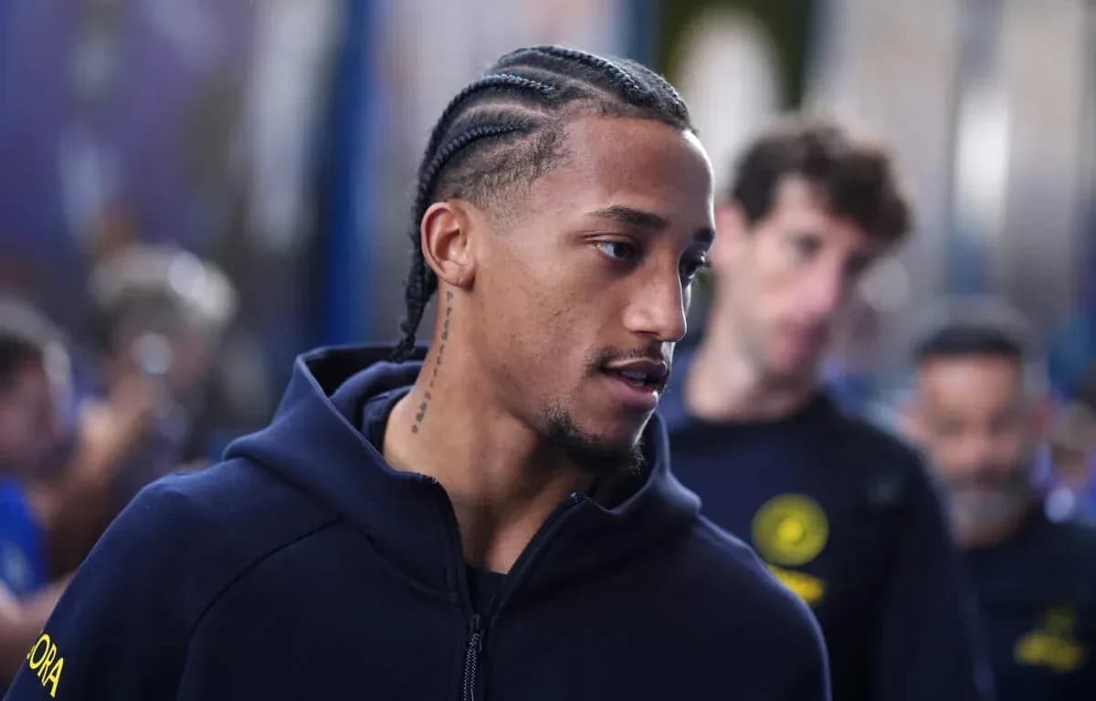 Player with braided hair walking in team apparel Player with braided hair walking in team apparel