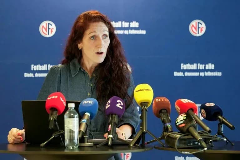 Speaker at press conference with multiple microphones Speaker at press conference with multiple microphones