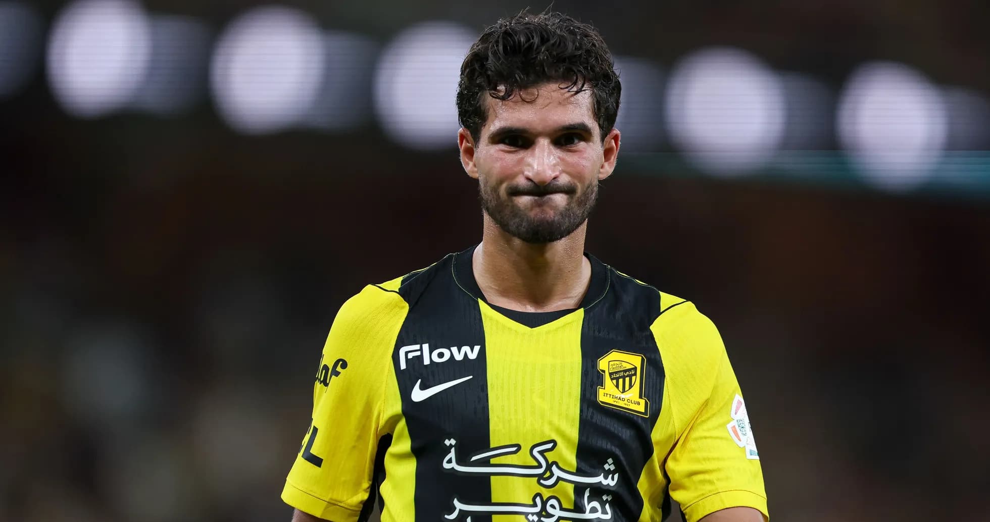 Player in yellow and black jersey on field Player in yellow and black jersey on field