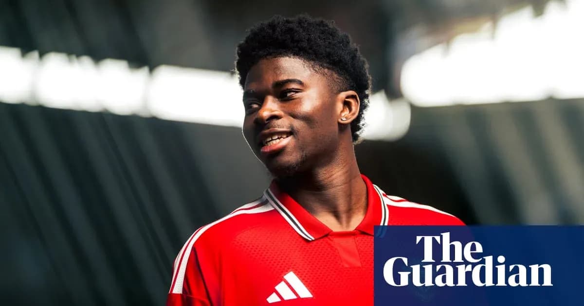 Player posing in red jersey with studio lighting Player posing in red jersey with studio lighting