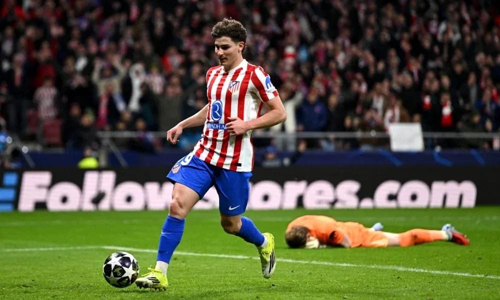 Atletico Madrid player celebrating after scoring a goal Atletico Madrid player celebrating after scoring a goal