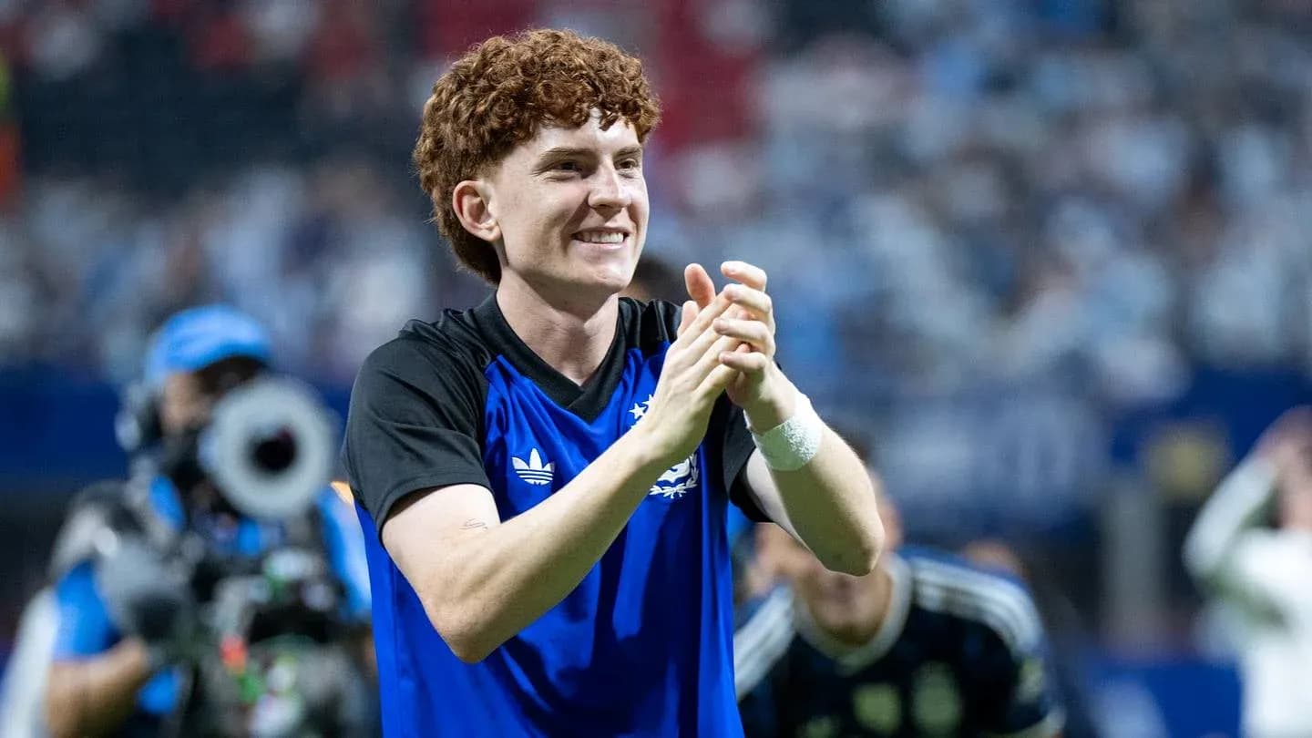 Player celebrating and clapping on the field Player celebrating and clapping on the field