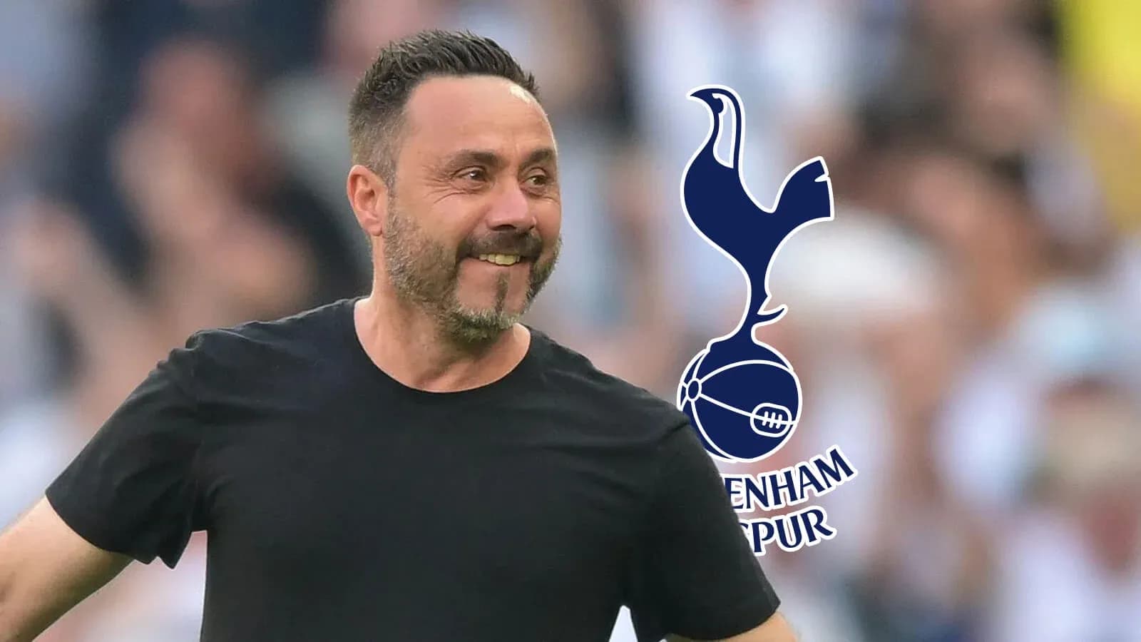 Manager smiling during match with Tottenham Hotspur logo Manager smiling during match with Tottenham Hotspur logo