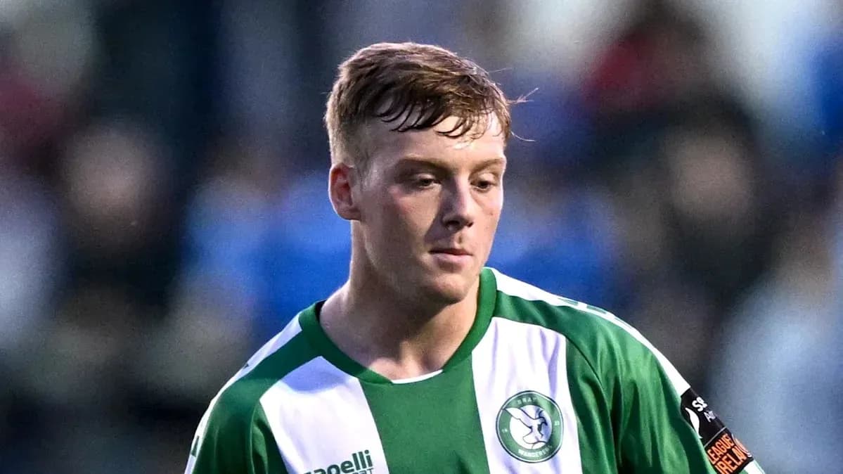 Player in green and white jersey during match Player in green and white jersey during match