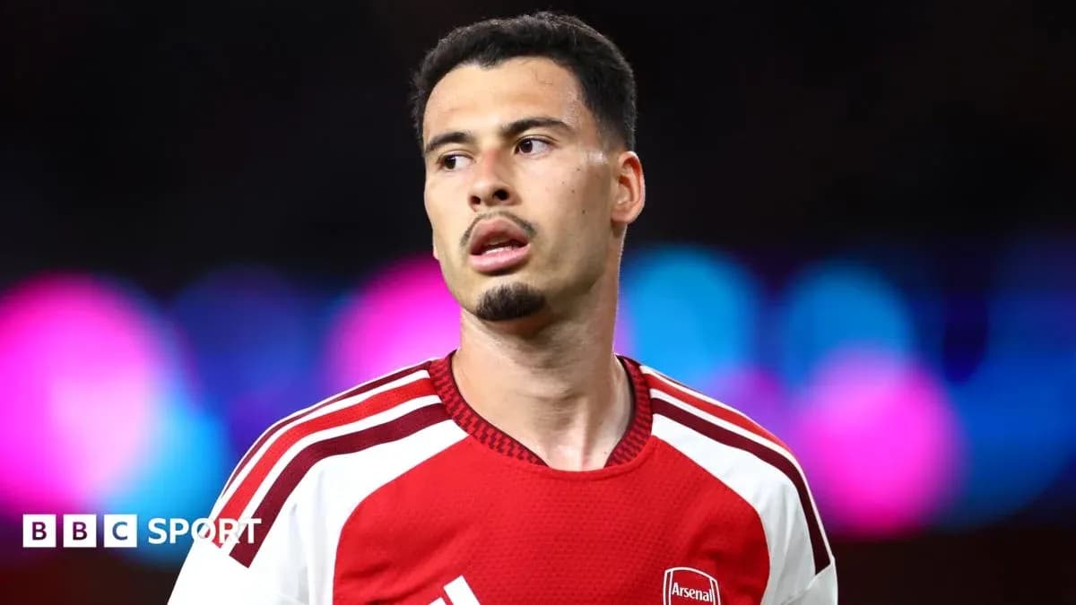 Football player wearing Arsenal kit during match Football player wearing Arsenal kit during match