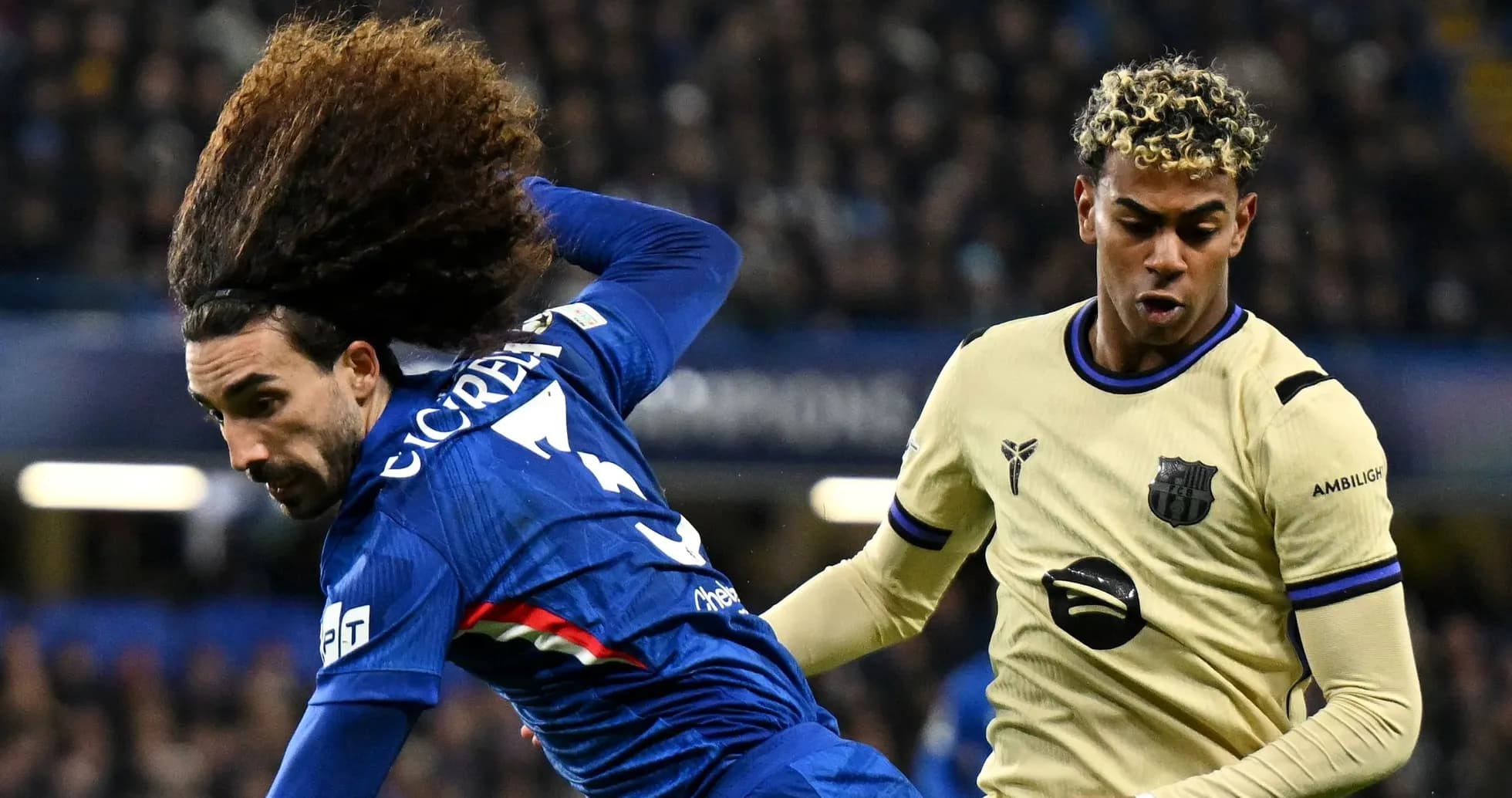 Two players contesting the ball during a match Two players contesting the ball during a match
