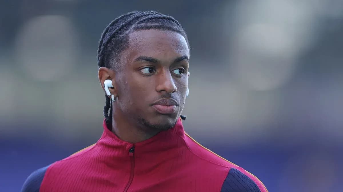 Player wearing earbuds, dressed in training gear Player wearing earbuds, dressed in training gear