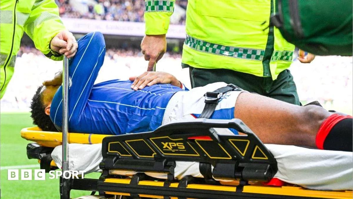 Player being assisted off the field on stretcher Player being assisted off the field on stretcher