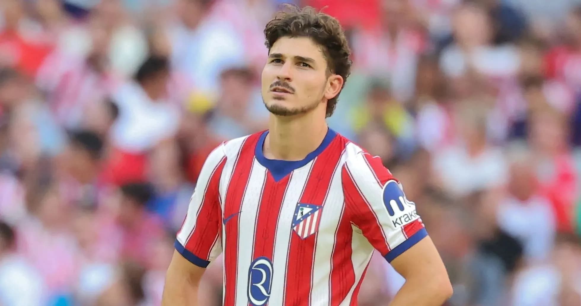 Player wearing Atlético Madrid jersey on the field Player wearing Atlético Madrid jersey on the field