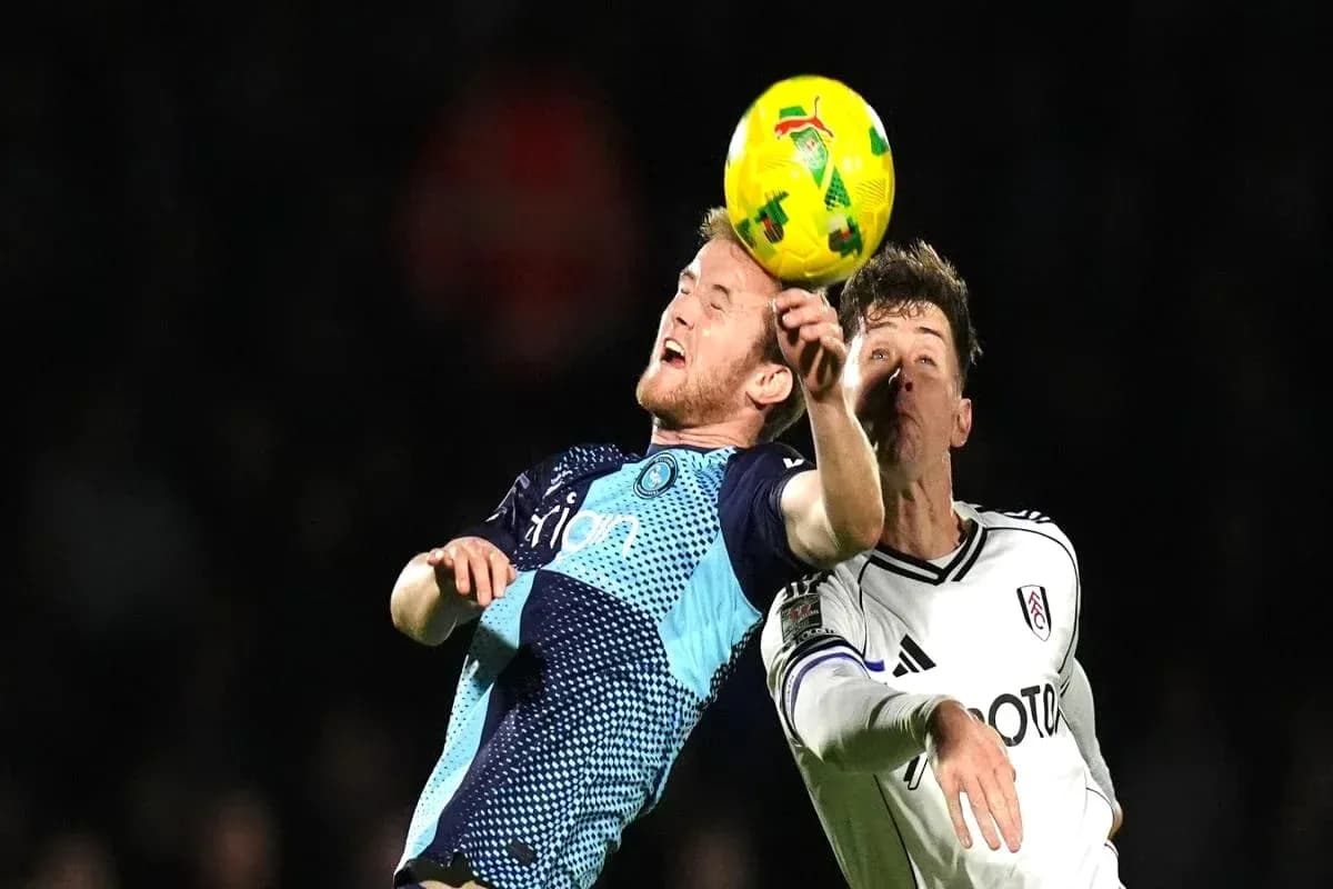 Two players contesting a header during a match Two players contesting a header during a match