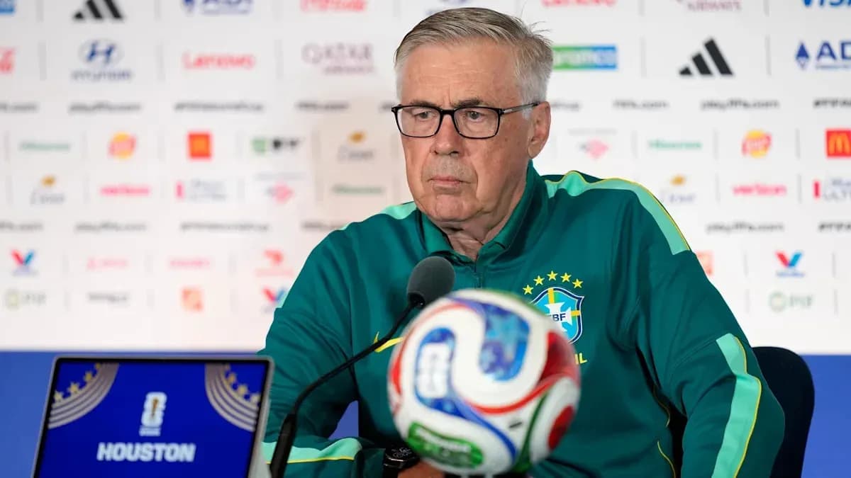 Coach at press conference with soccer ball in front Coach at press conference with soccer ball in front