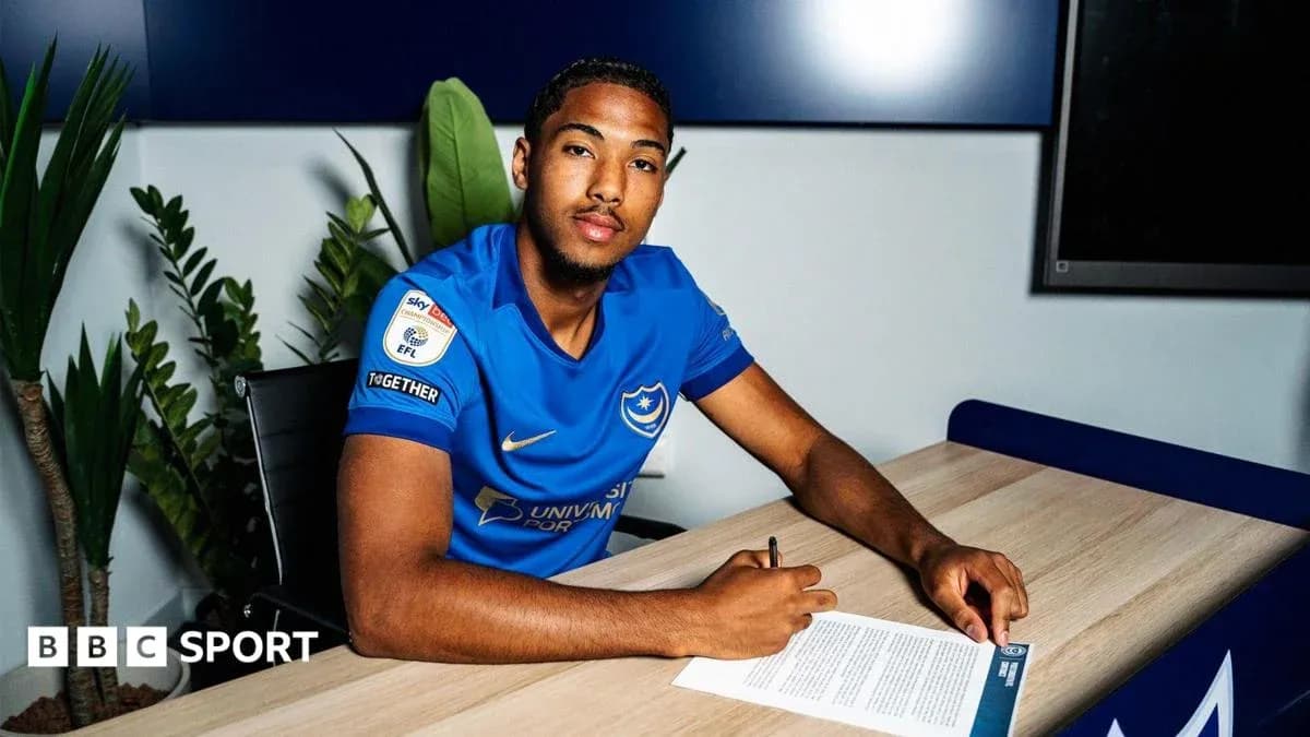 Player signing contract at desk in club office Player signing contract at desk in club office