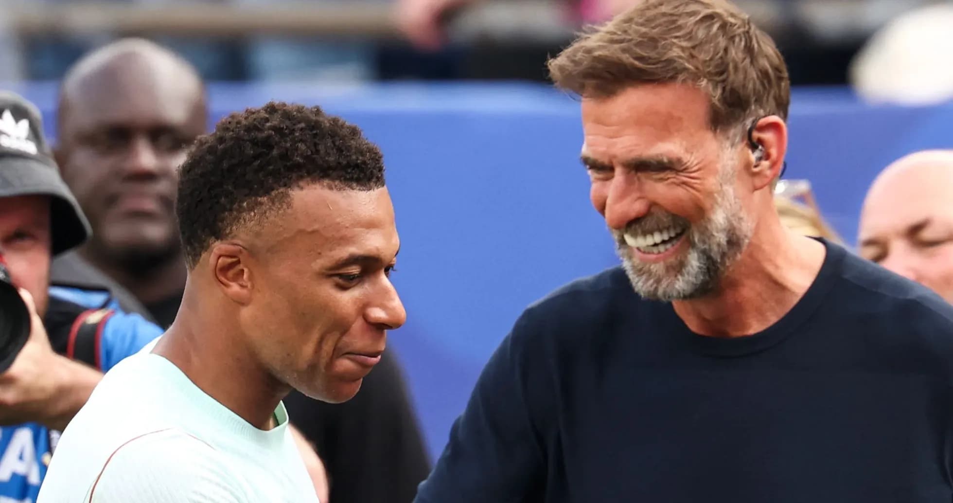 Kylian Mbappé and Jürgen Klopp smiling together Kylian Mbappé and Jürgen Klopp smiling together