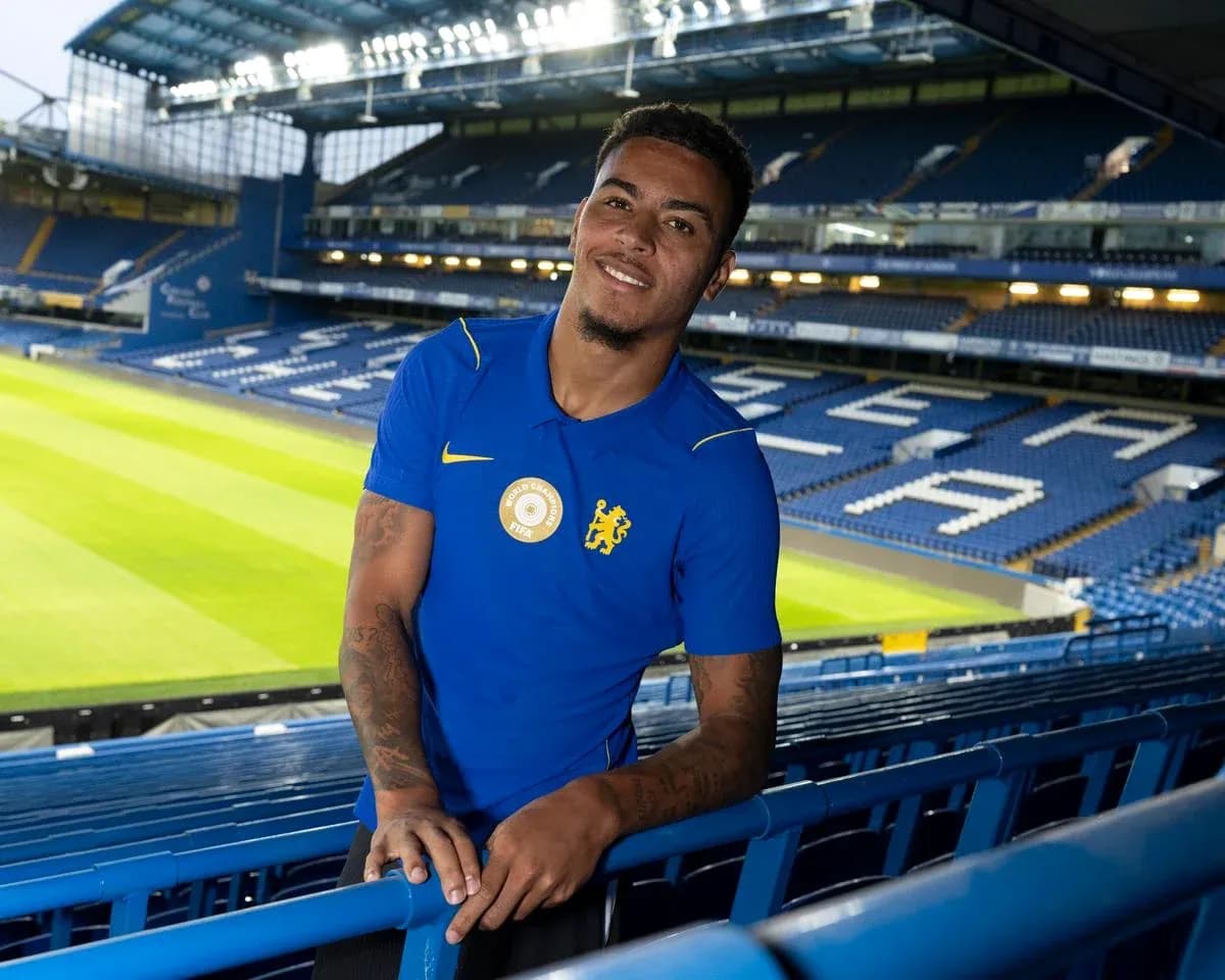 Player posing in Chelsea's stadium stands Player posing in Chelsea's stadium stands