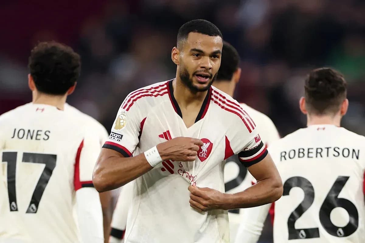 Liverpool player adjusting his shirt during match Liverpool player adjusting his shirt during match