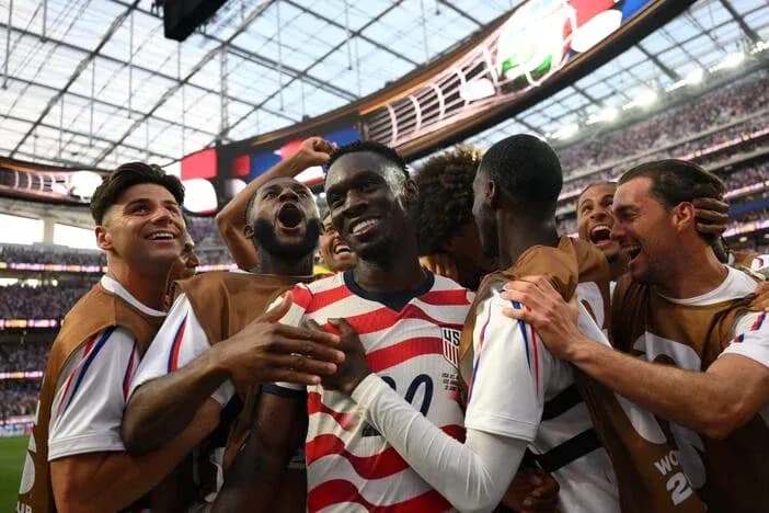 US players celebrating together after scoring a goal US players celebrating together after scoring a goal