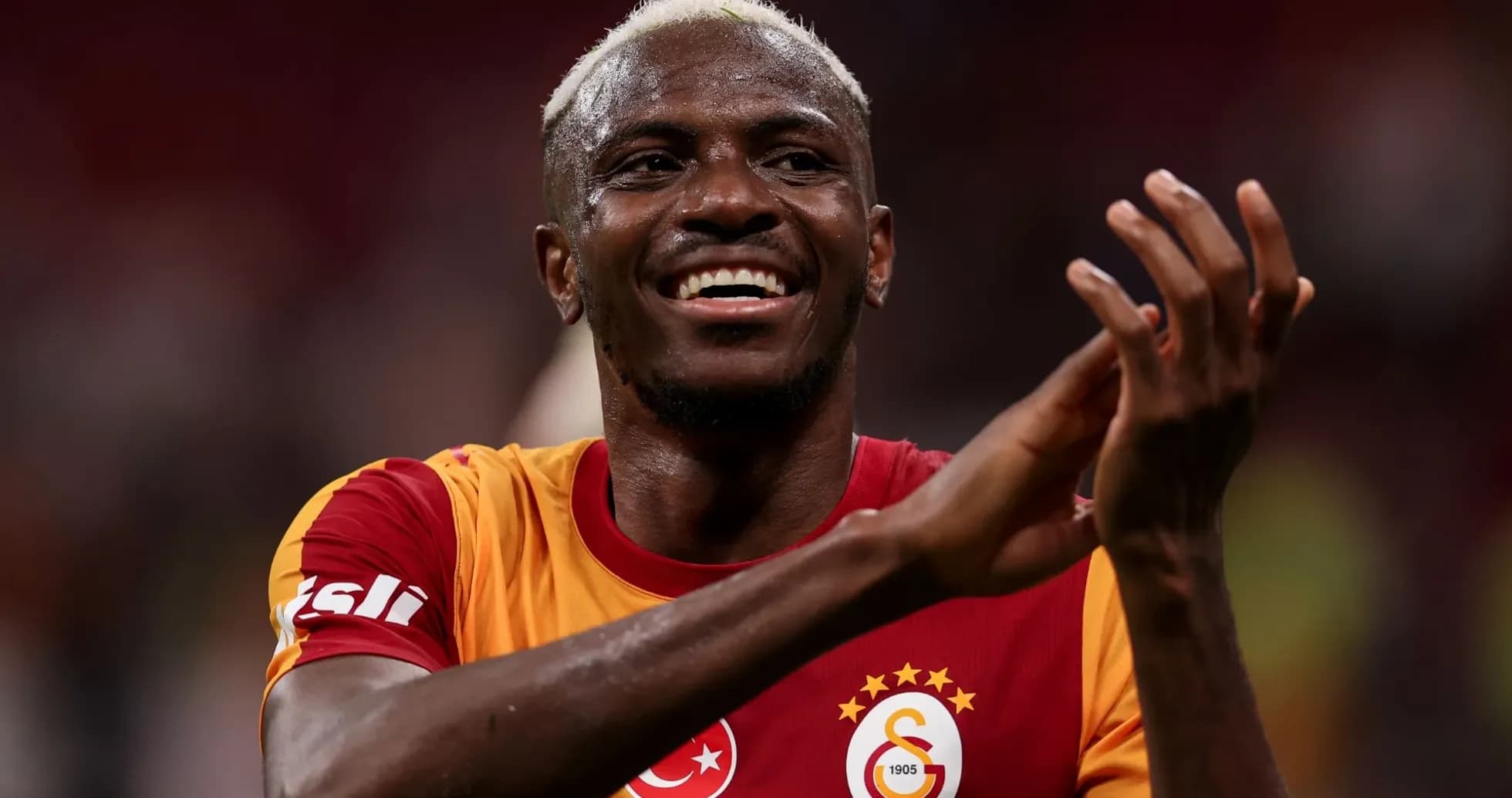 Player celebrating and applauding fans after match Player celebrating and applauding fans after match