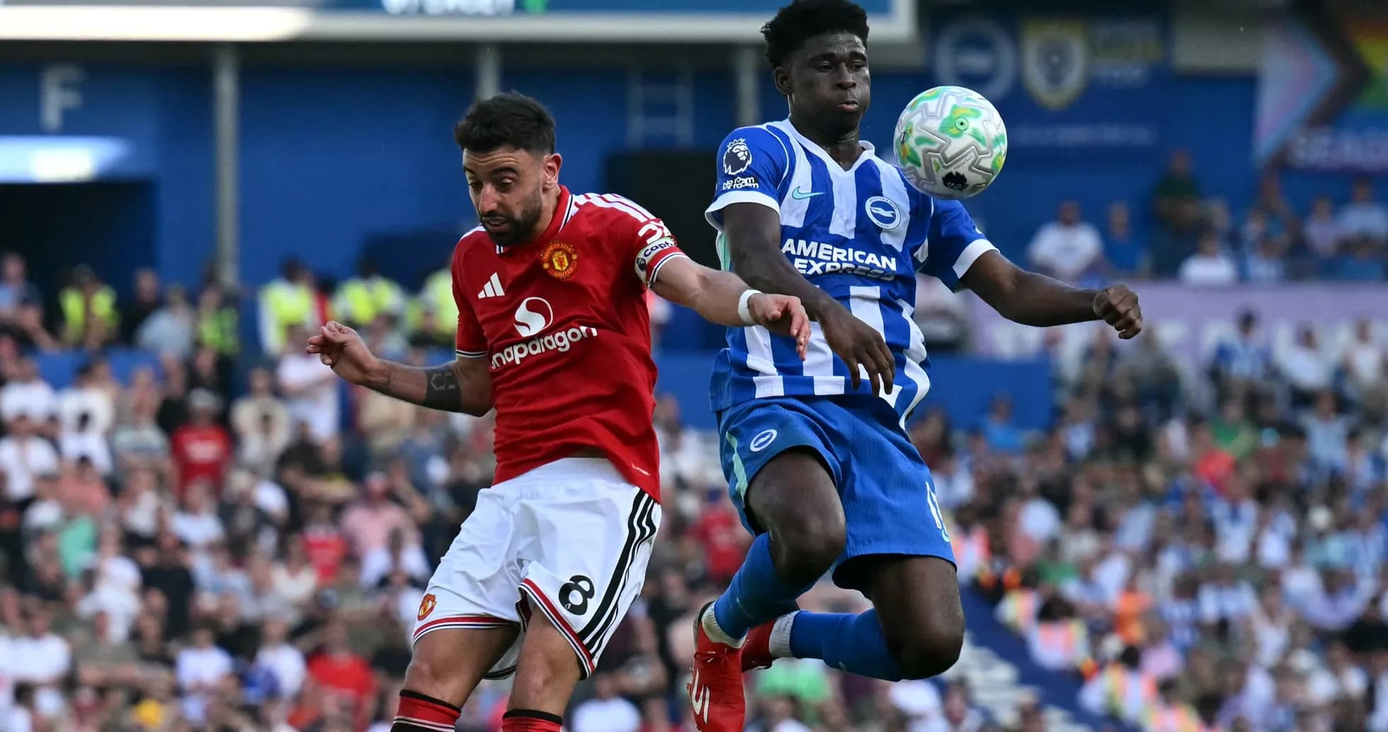 Player from Manchester United and Brighton contesting the ball Player from Manchester United and Brighton contesting the ball