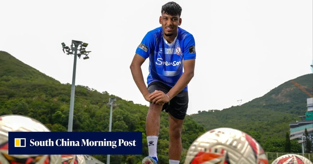 Player posing on training ground with footballs Player posing on training ground with footballs