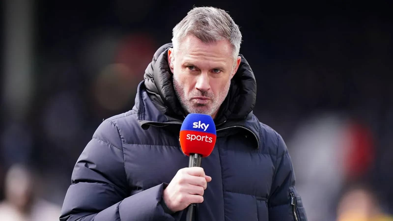 Presenter speaking into microphone on sports set Presenter speaking into microphone on sports set