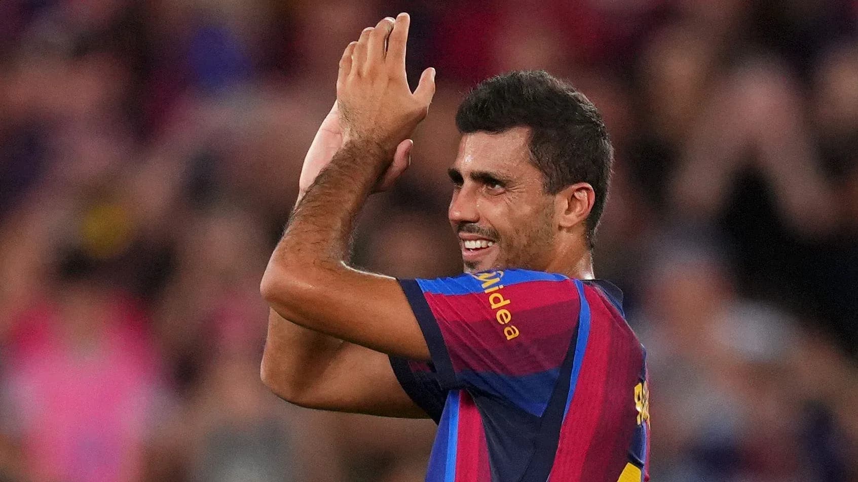 Player celebrating with fans after match at Camp Nou Player celebrating with fans after match at Camp Nou