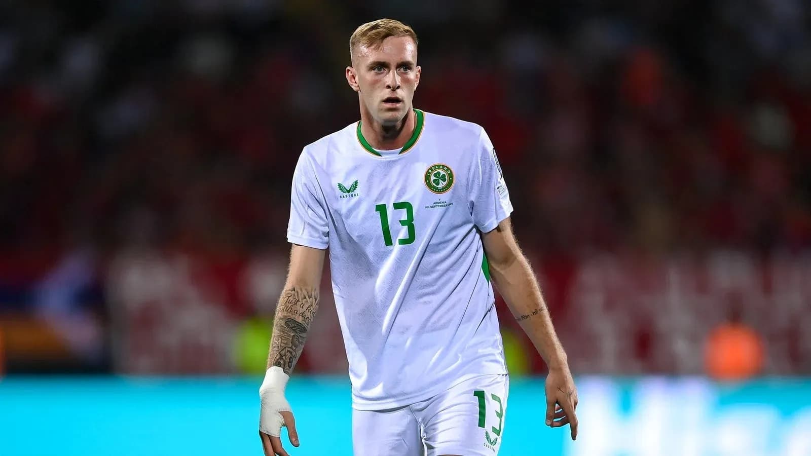 Player wearing white jersey during match on field Player wearing white jersey during match on field