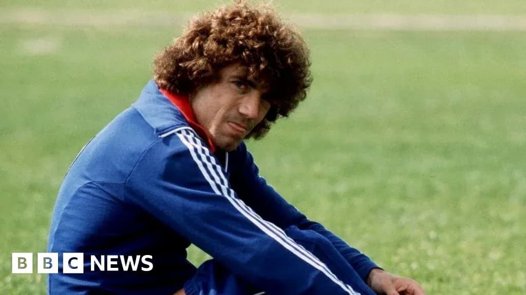 Athlete sitting on grass during training session Athlete sitting on grass during training session