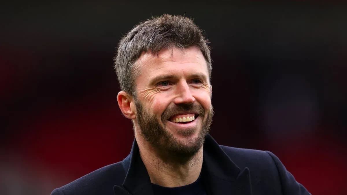 Man smiling on the sidelines of a stadium Man smiling on the sidelines of a stadium