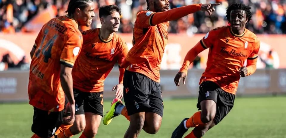 Players celebrating a goal during match Players celebrating a goal during match