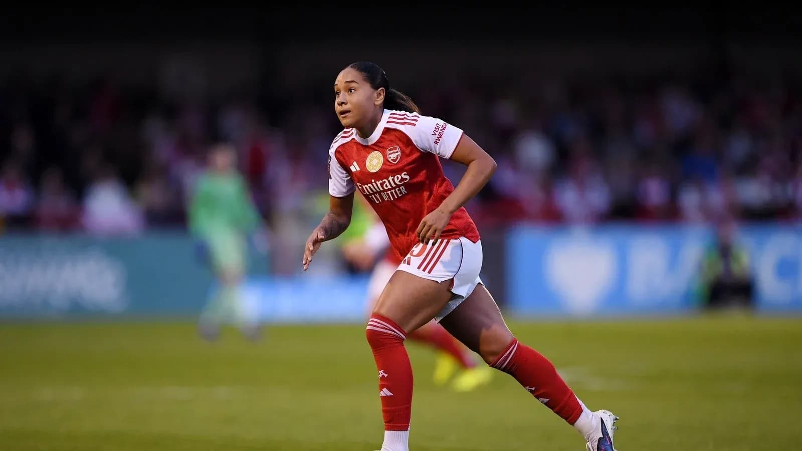 Player running during a match for Arsenal Player running during a match for Arsenal