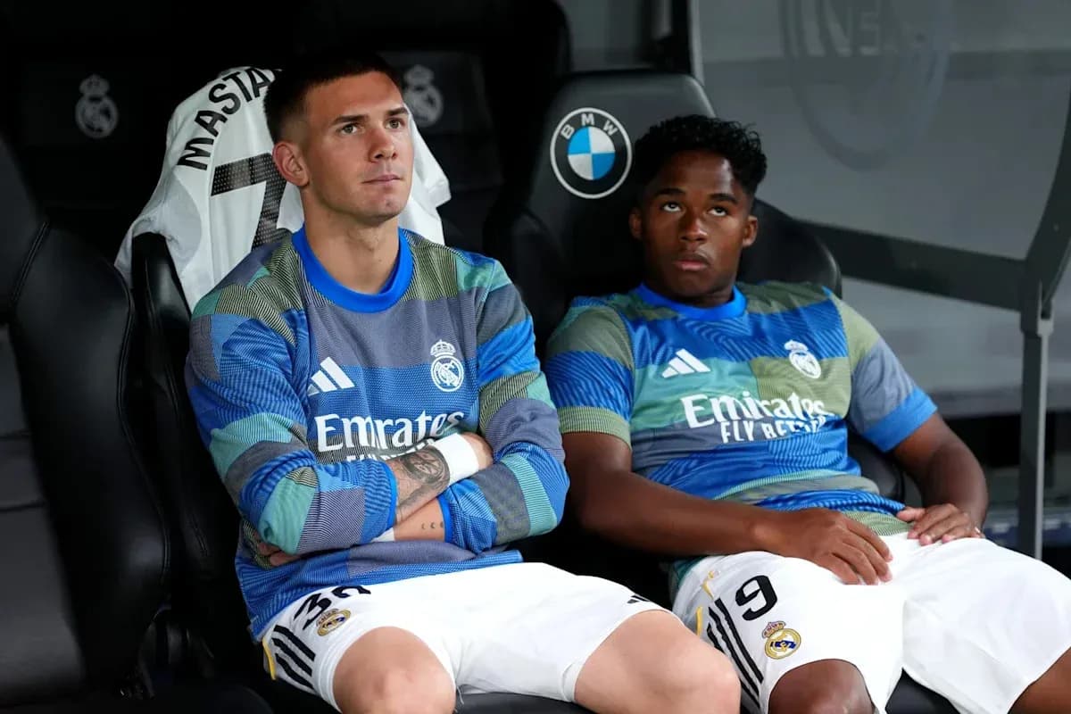 Two Real Madrid players seated on the bench Two Real Madrid players seated on the bench