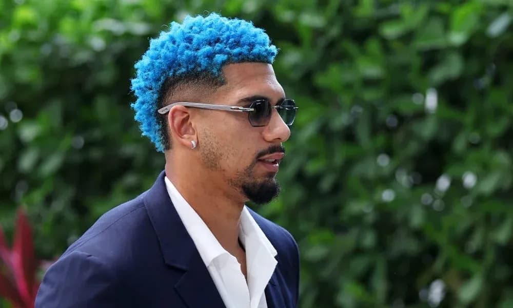 Man with blue hair wearing sunglasses outdoors Man with blue hair wearing sunglasses outdoors