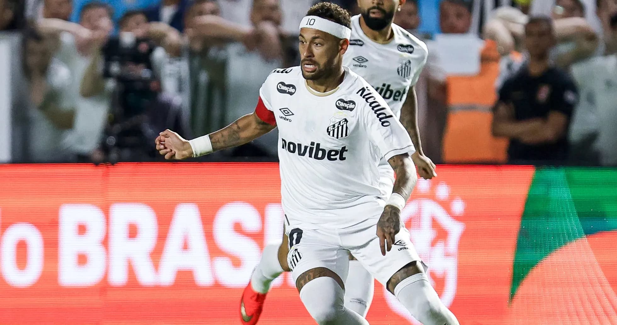 Neymar celebrating a goal during a match Neymar celebrating a goal during a match