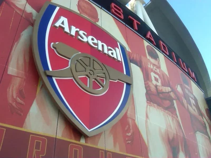 Arsenal club logo on stadium exterior wall Arsenal club logo on stadium exterior wall