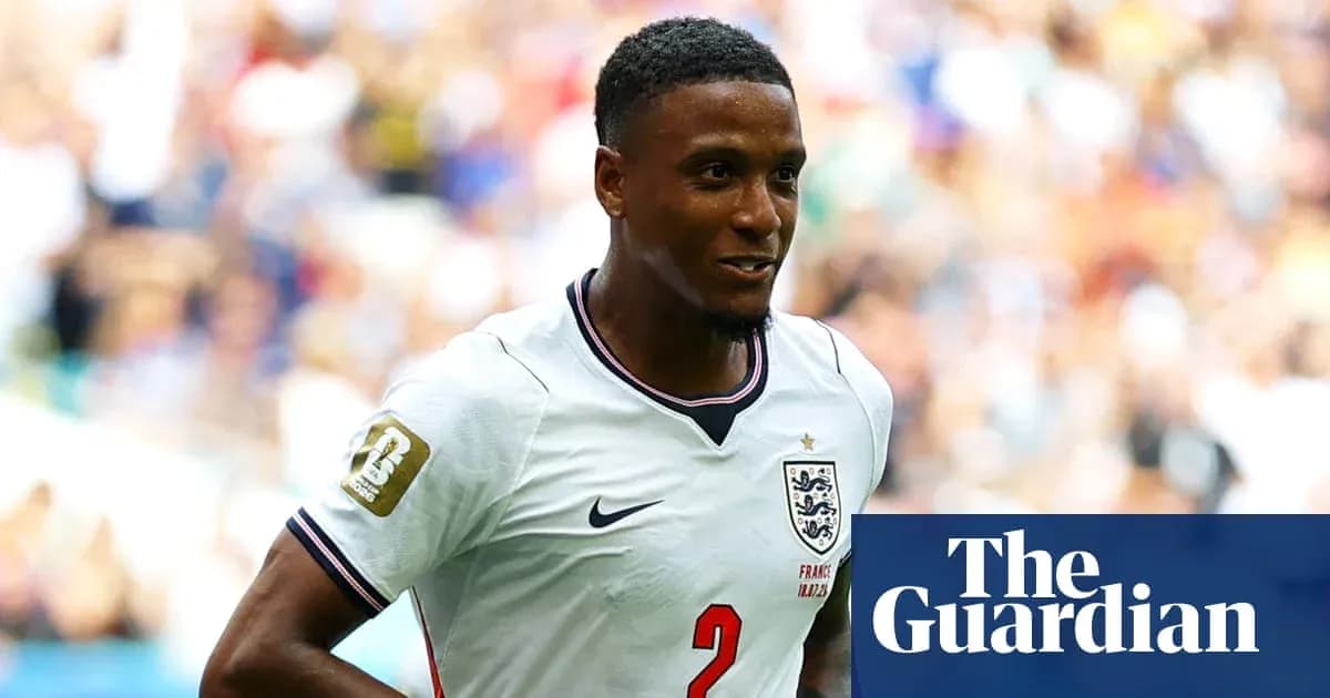 Football player in England jersey during match Football player in England jersey during match