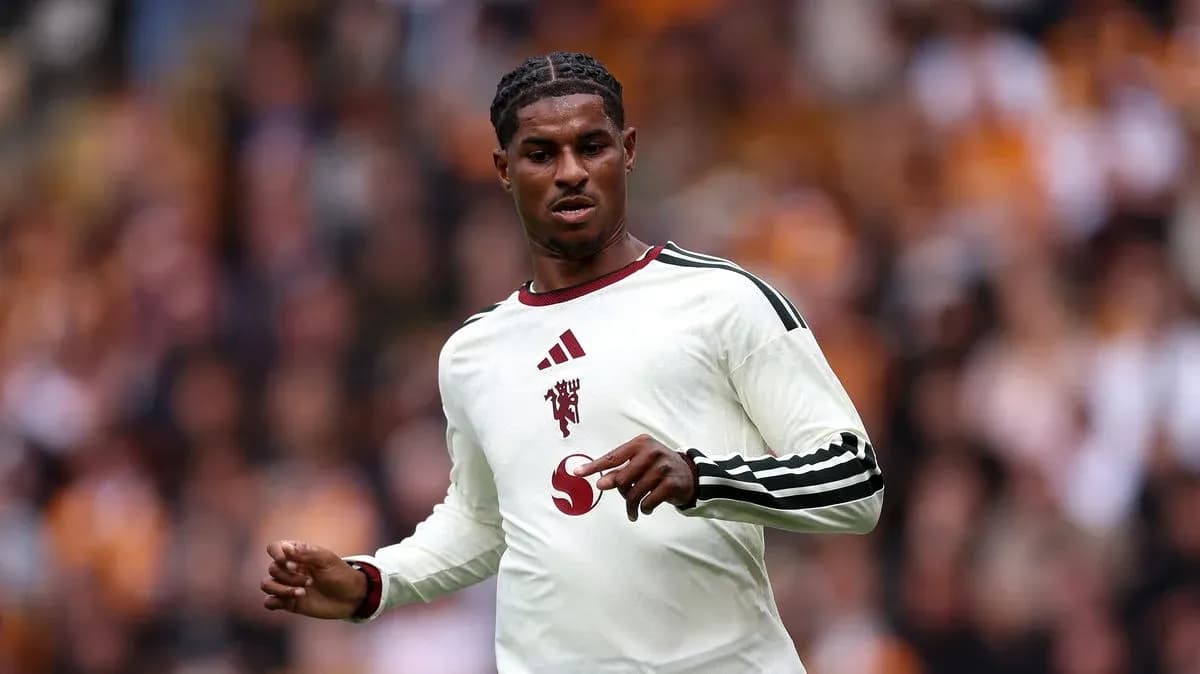 Player in white kit during football match action Player in white kit during football match action
