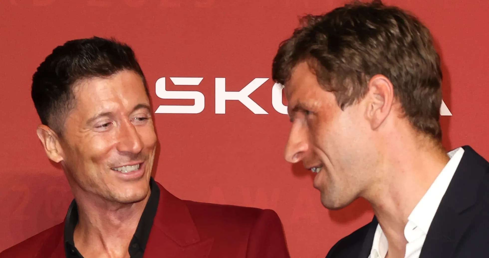 Two football players talking at an awards event Two football players talking at an awards event