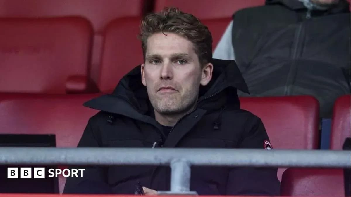 Person seated in stadium watching match Person seated in stadium watching match