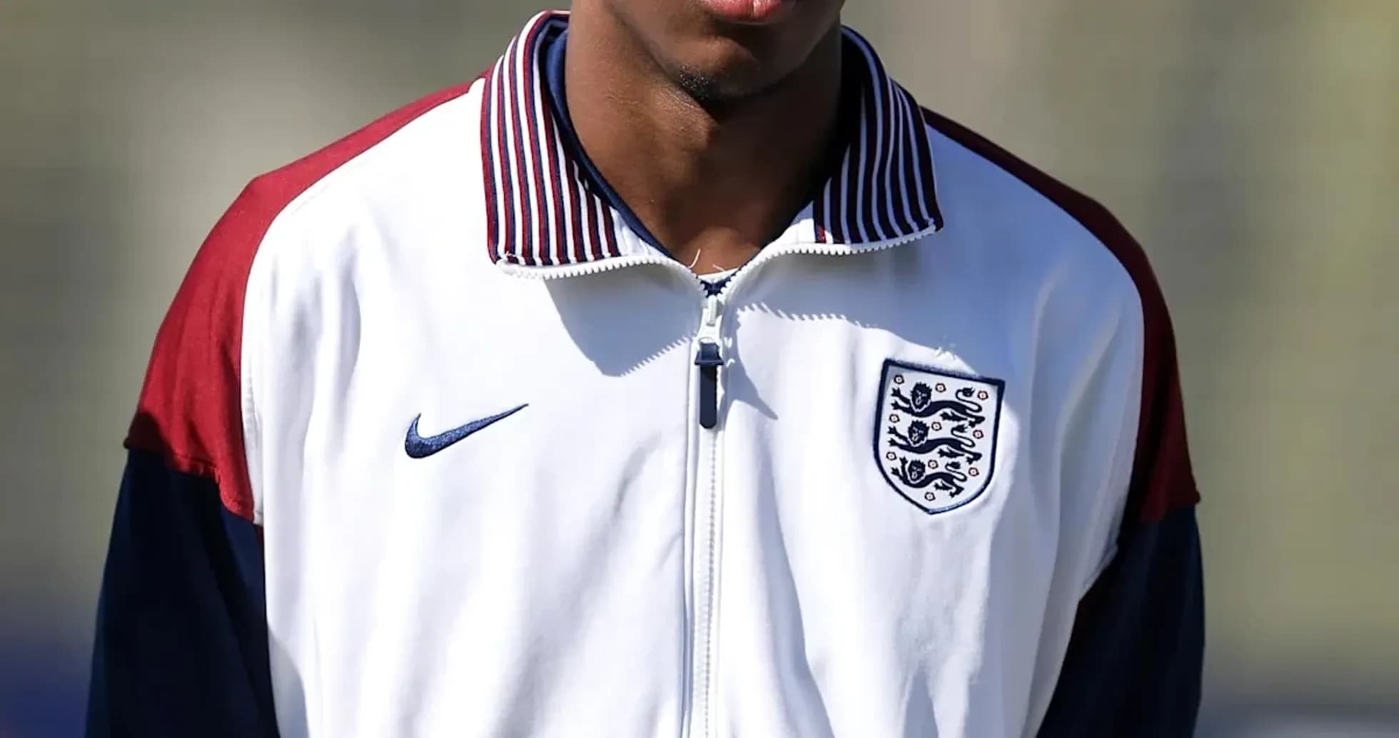 Player in England training jacket on field Player in England training jacket on field