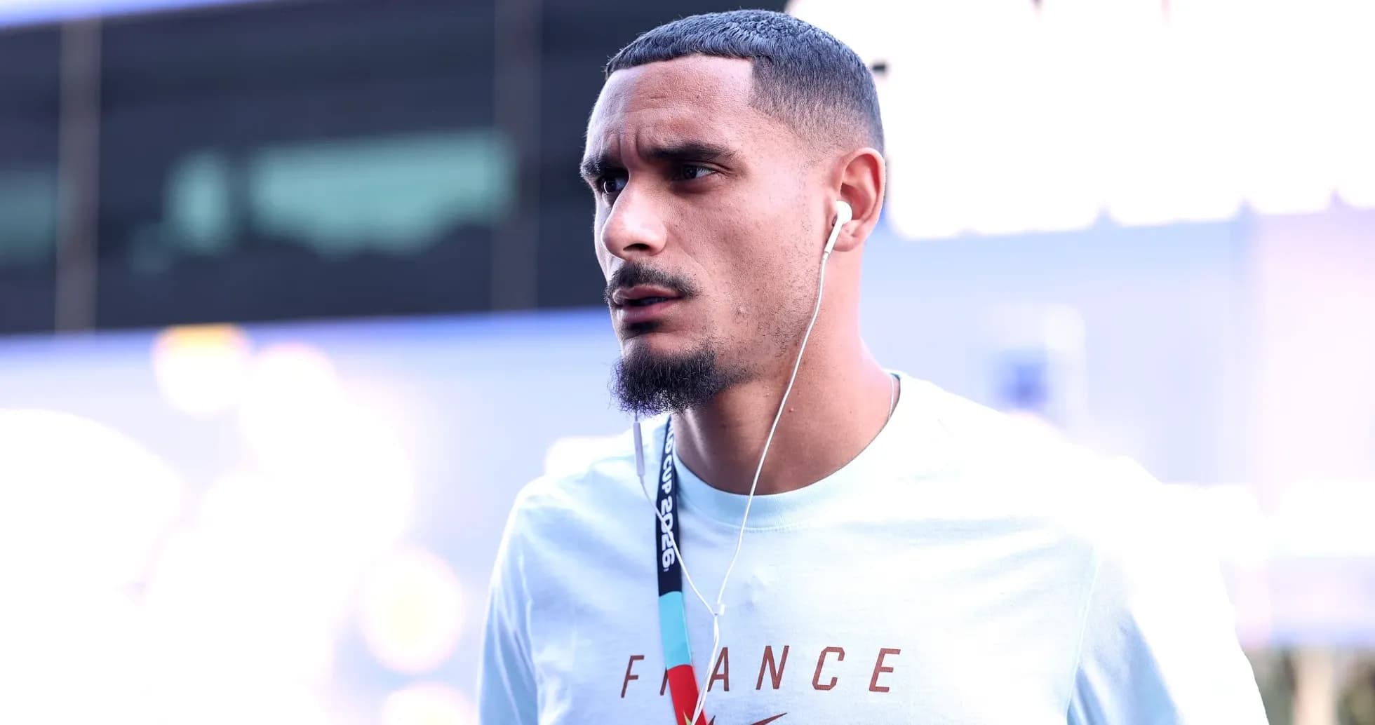 Player wearing headphones arriving at event venue Player wearing headphones arriving at event venue