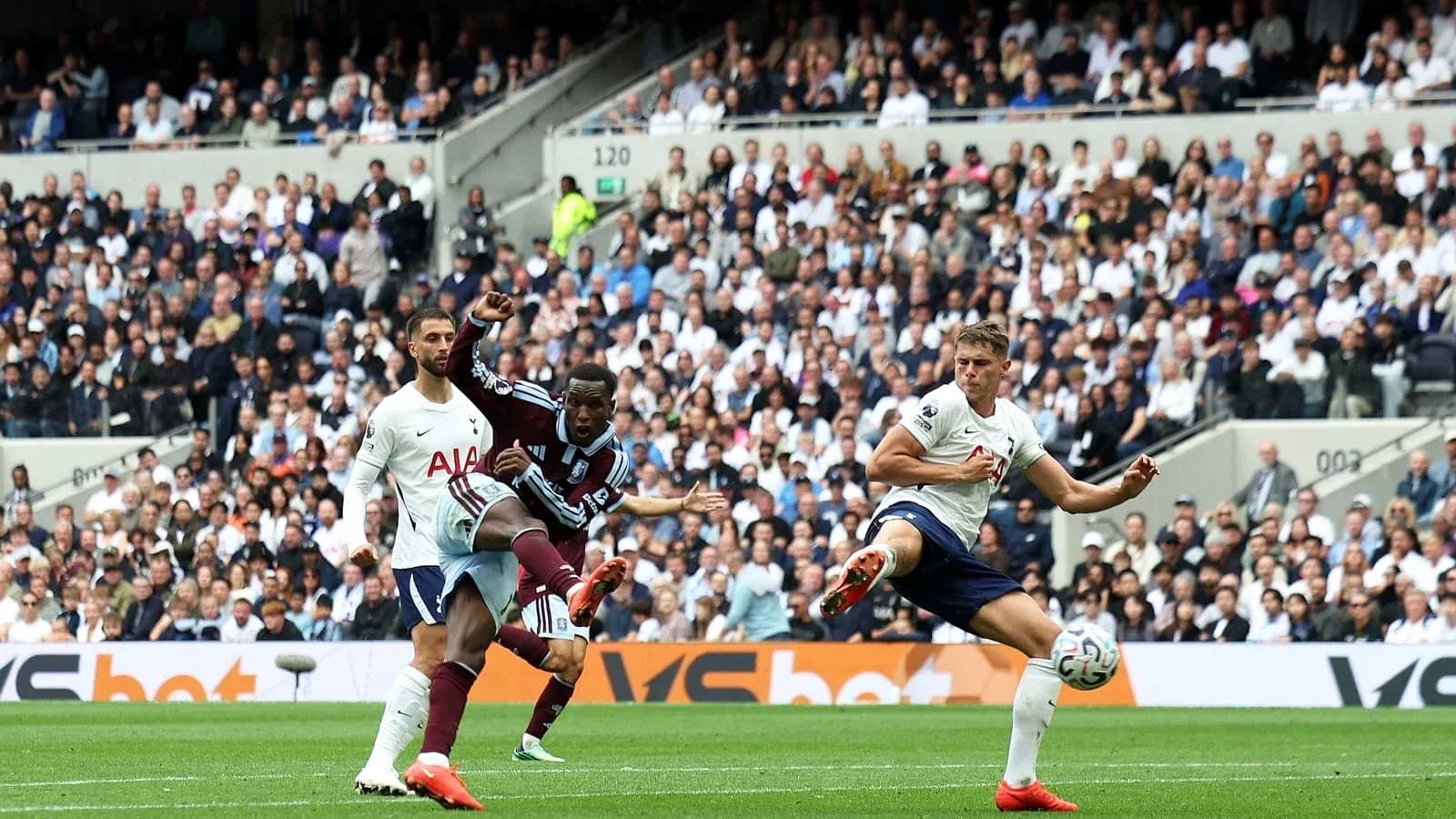 Player kicking the ball during a football match Player kicking the ball during a football match