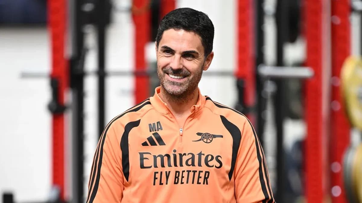 Arsenal manager in training facility wearing team gear Arsenal manager in training facility wearing team gear
