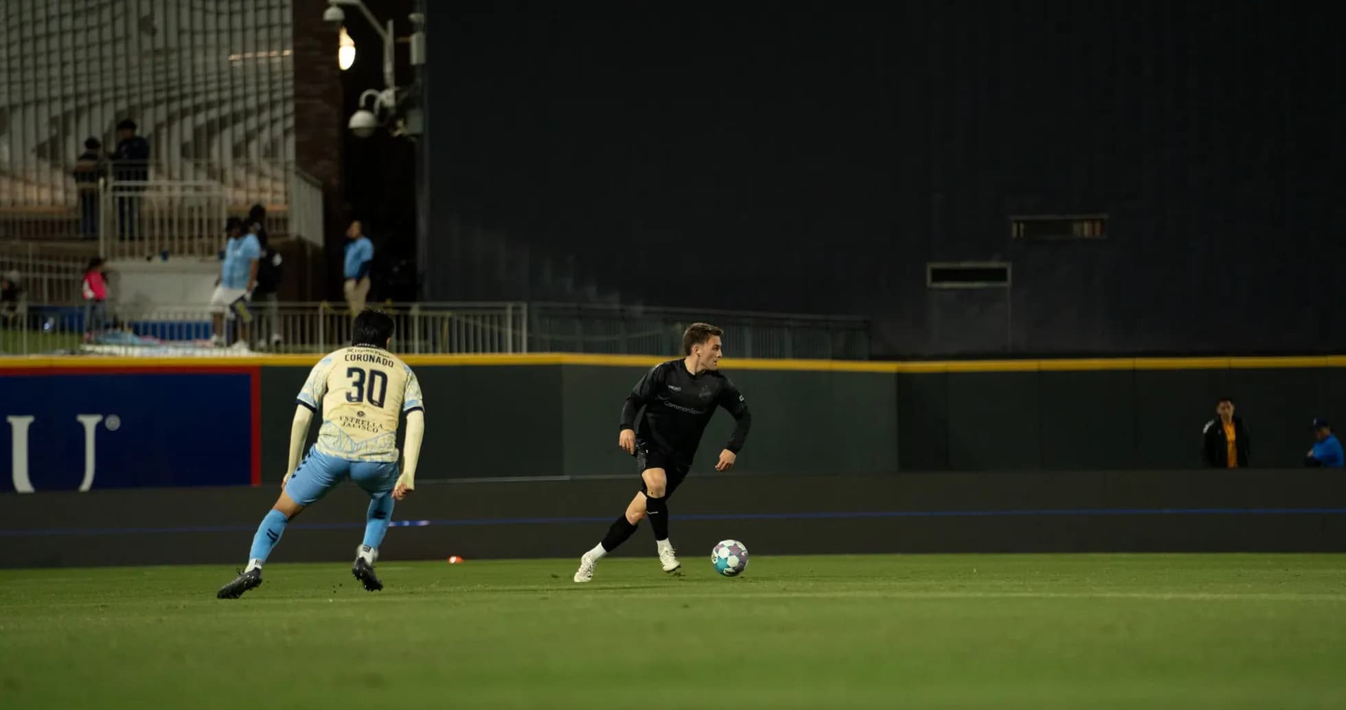 Players competing for the ball during match Players competing for the ball during match