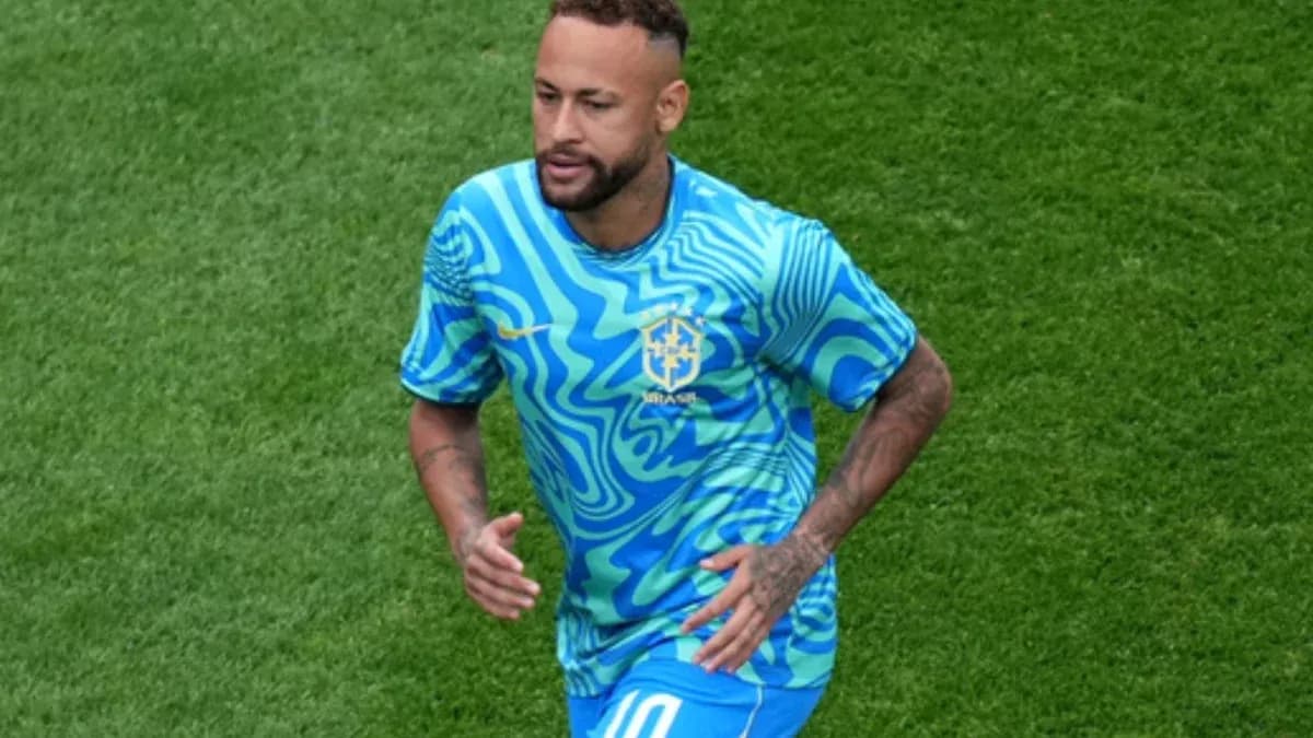 Player running on field in Brazil kit Player running on field in Brazil kit