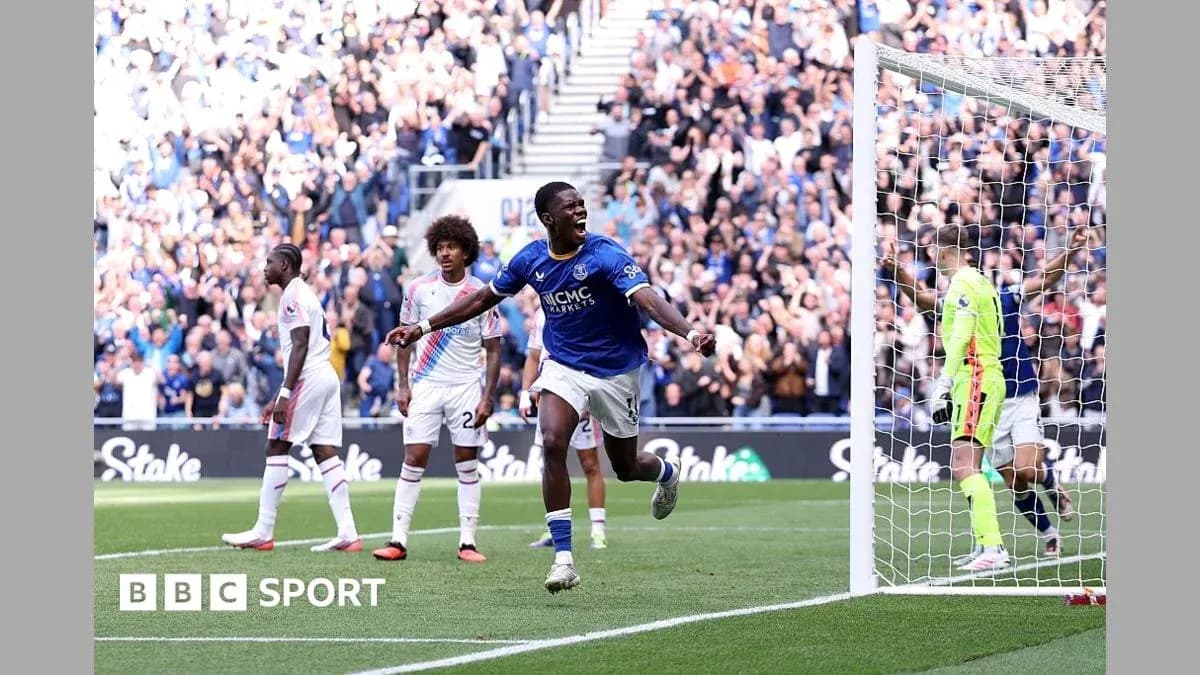 Player celebrating a goal in front of crowd Player celebrating a goal in front of crowd